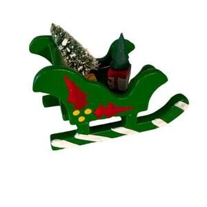 Small green painted wooden sleigh Christmas decoration with presents